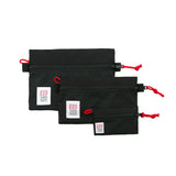 Topo Designs Accessory Bags- product shot of the medium, small, and micro accessory bags in black