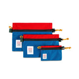 Topo Designs Accessory Bags- product shot of the medium, small, and micro accessory bags in blue/red