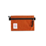 Topo Designs Accessory Bags in small clay orange.